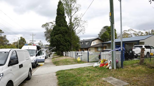 Pictured are police and tributes at 74 Chapman Parade at Faulconbridge in the Blue Mountains where two young brothers were allegedly murdered by their mother this week. Picture: Richard Dobson