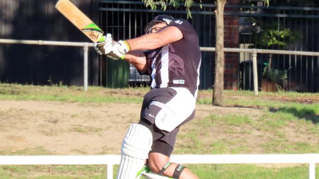 Anthony Rocca blasts one into the adjoining bowls club. Picture: Phil Skeggs