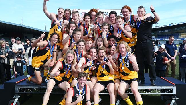 The Dandenong Stingrays and coach Craig Black after their grand final success.