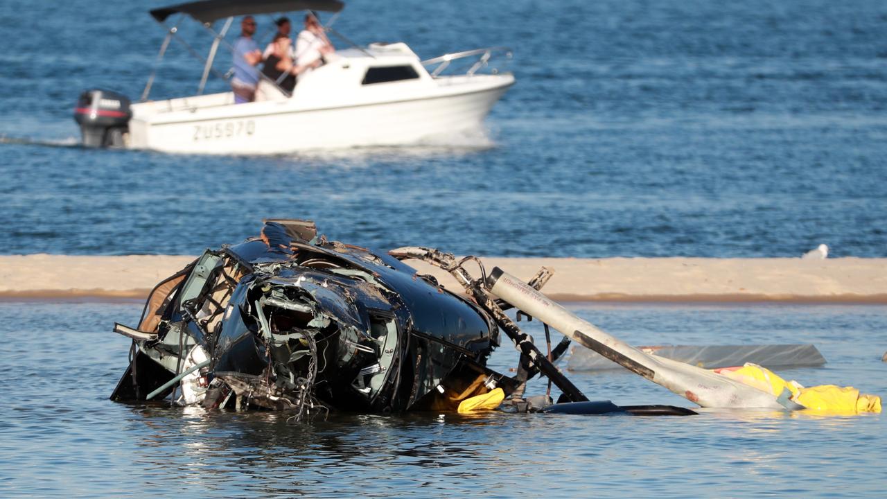 Four people were killed and many more were injured after two helicopters collided near Sea World on the Gold Coast. Picture Scott Powick