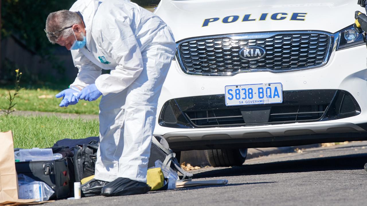 Police at the scene in Millicent where a man has been charged with murder. Picture by Frank Monger