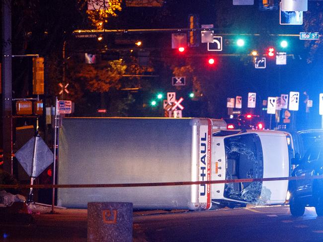 A U-Haul truck rests on its side after a high-speed chase with police in Edmonton. Picture: Jason Franson/The Canadian Press via AP