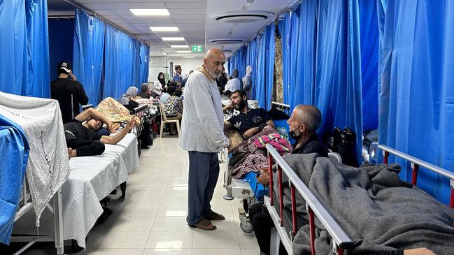 A doctor treats patients and displaced people at al-Shifa Hospital in Gaza City. Picture: AFP