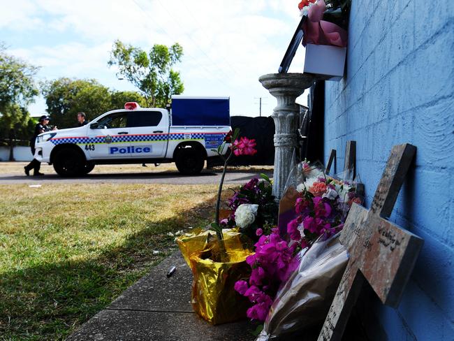 Flowers and crosses are seen on the side of the Buff Club in Darwin where Michael Sisois was murdered. Picture: Keri Megelus