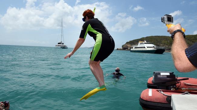 One Nation Senator Pauline Hanson leaps into the waters of the Great Barrier Reef off Great Keppel Island. Picture: AAP Image/Dan Peled.