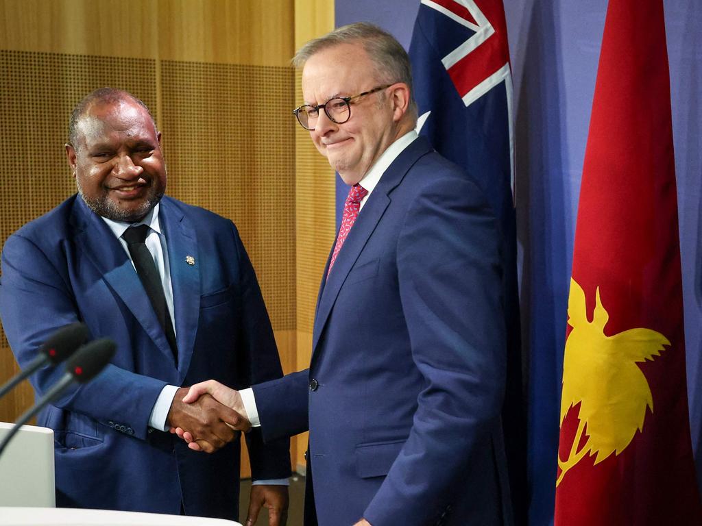 Australian PM Anthony Albanese (R) shakes hands with Papua New Guinea PM James Marape during the landmark announcement. Picture: David Gray/AFP