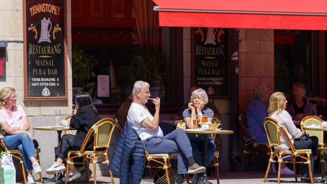 People dine out in Stockholm, Sweden, as much of the globe was in lockdown.