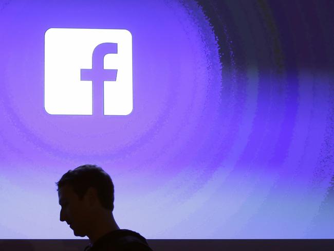 Facebook CEO Mark Zuckerberg walks at the company's headquarters in Menlo Park, California. Britain's Commissioner Elizabeth Denham told the BBC that she was investigating Facebook. Picture: AP