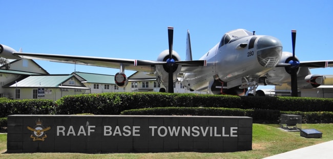 An ADF captain has been found not guilty of indecently assaulting a subordinate at the Townsville RAAf base after a night out .