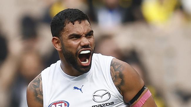 MELBOURNE, AUSTRALIA - AUGUST 19: Tarryn Thomas of the Kangaroos celebrates kicking a goal during the round 23 AFL match between Richmond Tigers and North Melbourne Kangaroos at Melbourne Cricket Ground, on August 19, 2023, in Melbourne, Australia. (Photo by Daniel Pockett/Getty Images)