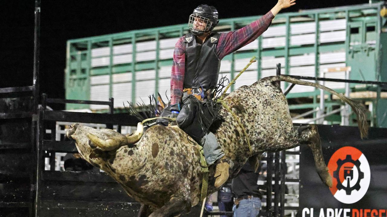 Shane Dyer competes in the Great Northern Bull riding series bull ride event at the Mossman Showgrounds. Picture: Stephen Harman