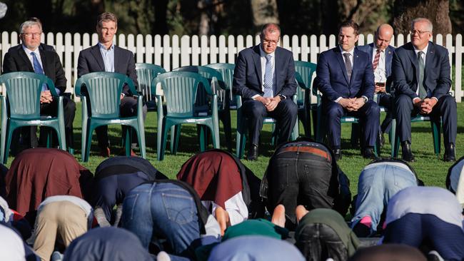 Muslim worshippers pray in front of their political guests at Parramatta Park. Picture: Jason Edwards