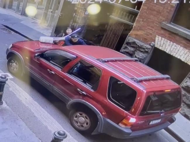 The victim was left clinging to the front of his own car.