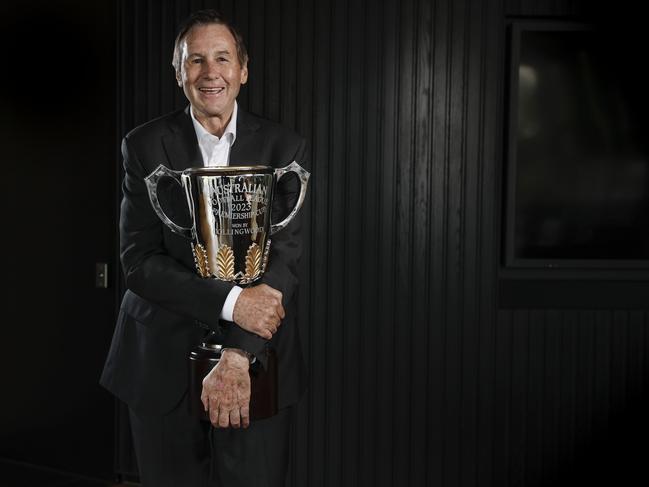 Outgoing Collingwood president Jeff Browne hugs the 2023 premiership cup. Picture: Michael Klein