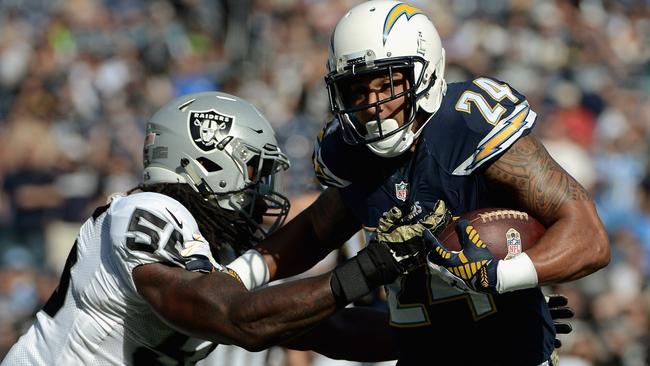 Ryan Mathews #24 of the San Diego Chargers tries to get past Sio Moore #55.