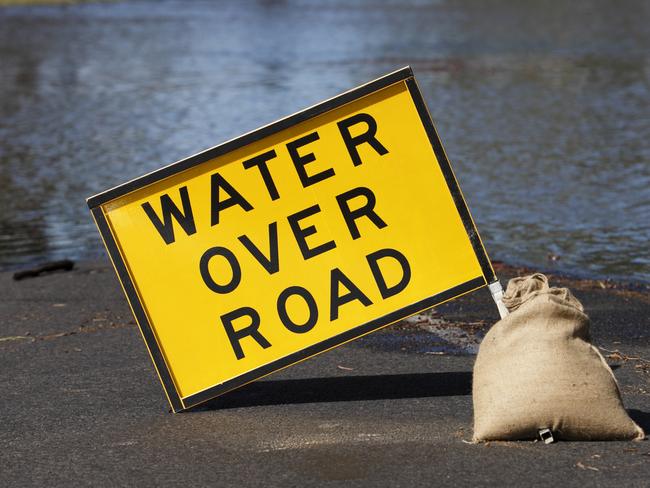 water over the road sign