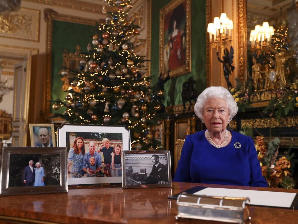 The carefully curated collection of family images seen during the Queen’s Christmas address. Picture: Getty Images.