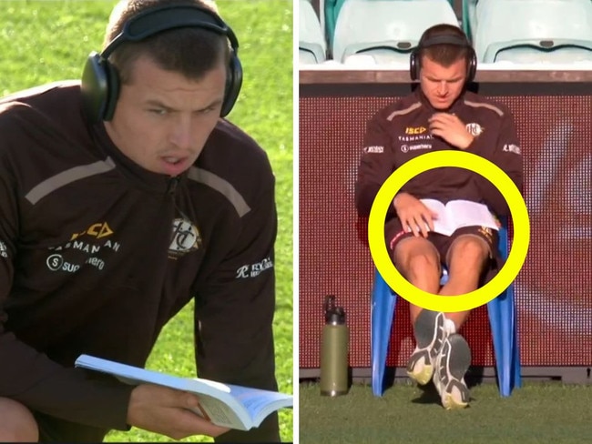 Jack Ginnivan gets some light reading done pre-game.