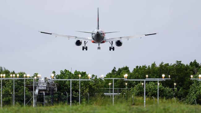 A Jetstar commercial passenger plane comes in to land at the Cairns Airport, using an Instrument Landing System to guide the aircraft approach angle need to land safely. Picture: Brendan Radke.