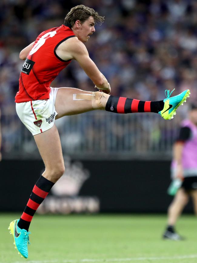 Joe Daniher kicks for goal.