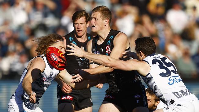 Port Adelaide big man Sam Hayes fires out a handpass in Saturday’s loss to Geelong. Picture: Daniel Pockett/AFL Photos