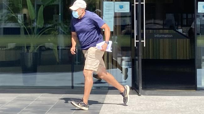 Christopher Lichtwark runs from the ACT Law Courts on Thursday. Picture: Julia Kanapathippillai