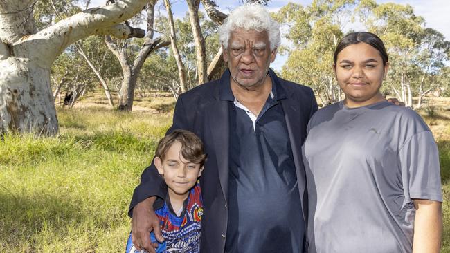 William Tilmouth (centre), Chairman of Childrens Ground in Alice Springs, with his grandchildren. Picture: Grenville Turner