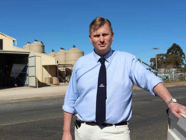 Member for Southern Downs James Lister MP poses in Warwick with street and truck in background. Generic, warwick, stanthorpe, politics, local politician, parliament