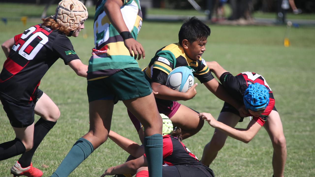 King of the Country U/13 Rugby Union tournament at Overall park Southport. Surfers Paradise(Yellow Green ) V Far North Coast (red black). Picture Glenn Hampson