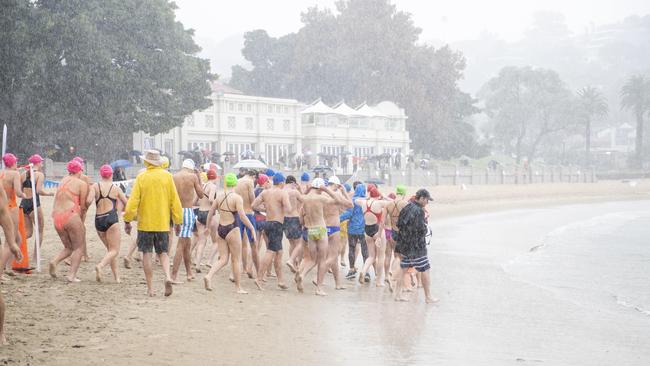 Wild weather captured at the Balmoral Swim, now in its 32nd year, on Sunday as NSW endured days of rain. Picture: NCA Newswire/ Monique Harmer