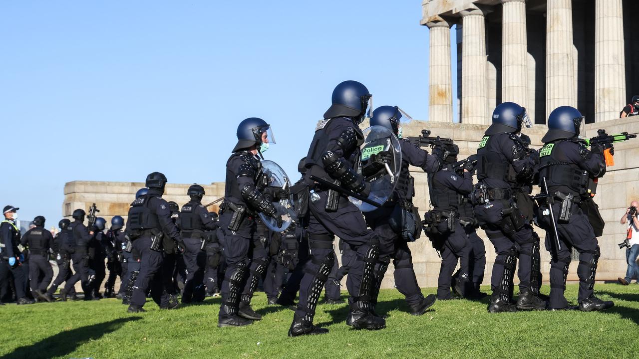 Police advance on protesters to clear them from the Shrine of Remembrance. Picture: NCA NewsWire / Ian Currie