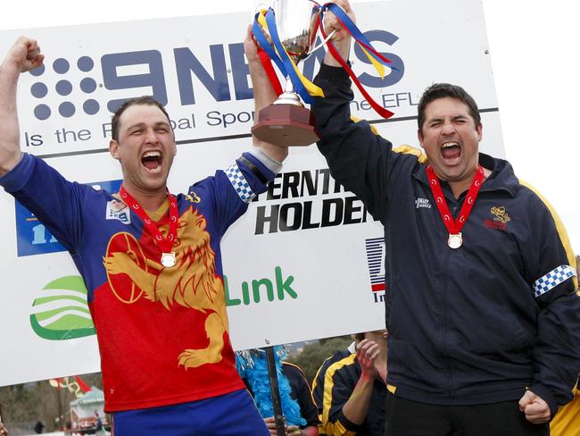 s12wg209 EFL Division 2 Grand Final - Mulgrave v Bayswater. Captain Brad Fowler and coach Hayden Stanton raise the cup.