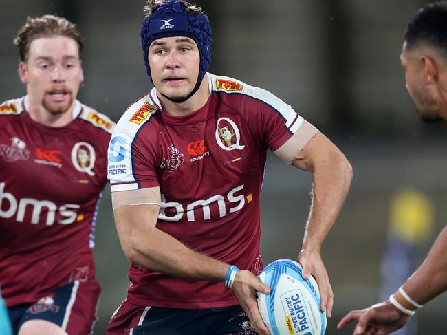 WHANGAREI, NEW ZEALAND - APRIL 12: Josh Flook of the Queensland Reds  looks to pass during the round eight Super Rugby Pacific match between Moana Pasifika and Queensland Reds at Semenoff Stadium, on April 12, 2024, in Whangarei, New Zealand. (Photo by Fiona Goodall/Getty Images)