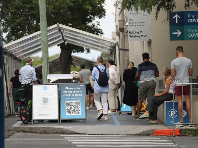 Daily Telegraph December 24/21. Covid testing lines snake around lanes and buildings at the RPA hospital in Camperdown .picture John Grainger