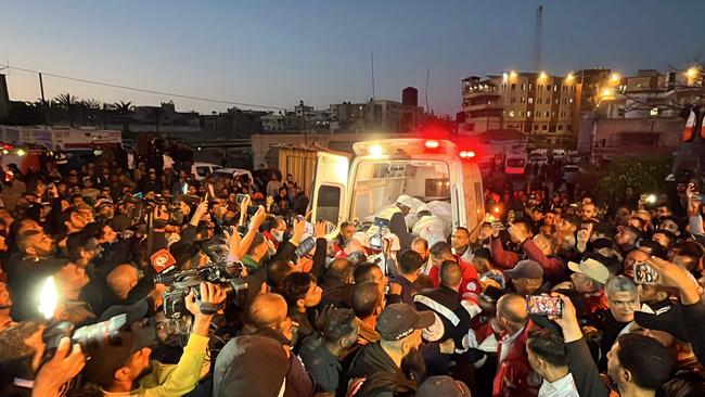 Paramedics take from an ambulance some of the bodies of Palestinian first responders who were killed a week before in Israeli military fire on ambulances, into Nasser Medical Complex in Khan Younis in the southern Gaza Strip. Picture: AFP