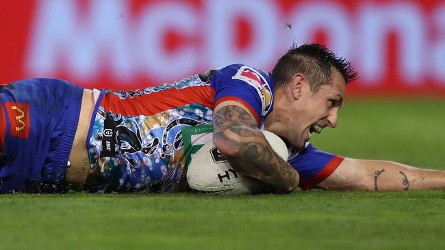 Newcastle's Mitchell Pearce scores a try during the Sydney Roosters v Newcastle Knights NRL match at McDonald Jones Stadium, Newcastle. Picture: Brett Costello