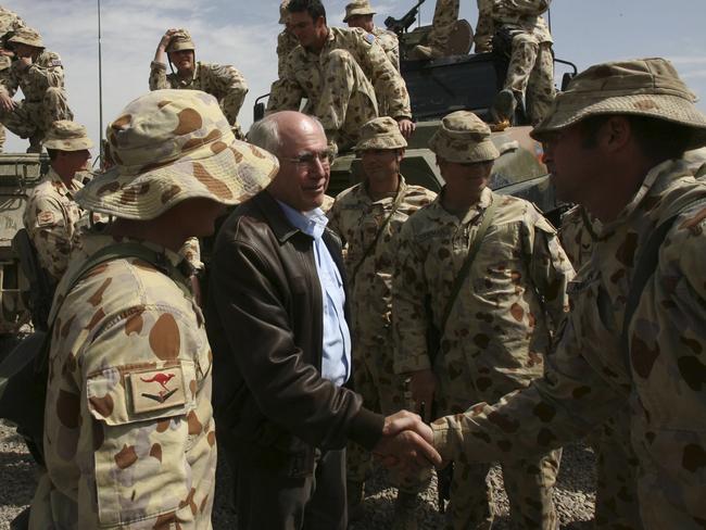 Former PM John Howard with soldiers in Tarin Kowt, Afghanistan, in 2007. Picture: Andrew Taylor