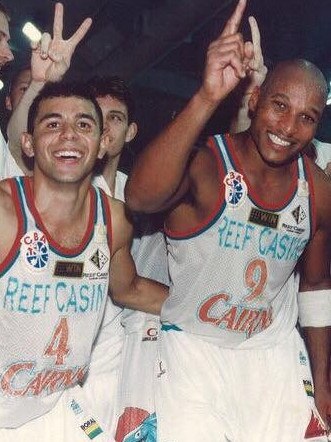 Timmy Duggan (left) celebrates Cairns Marlins’ 1998 Australian Basketball Association title win with teammates.