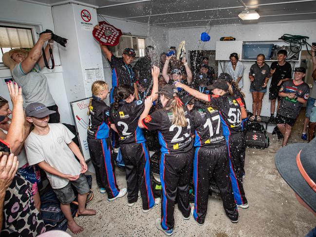 The victorious Southern Swans celebrate the team song with friends, family and a spray of water. Picture: Julian Andrews