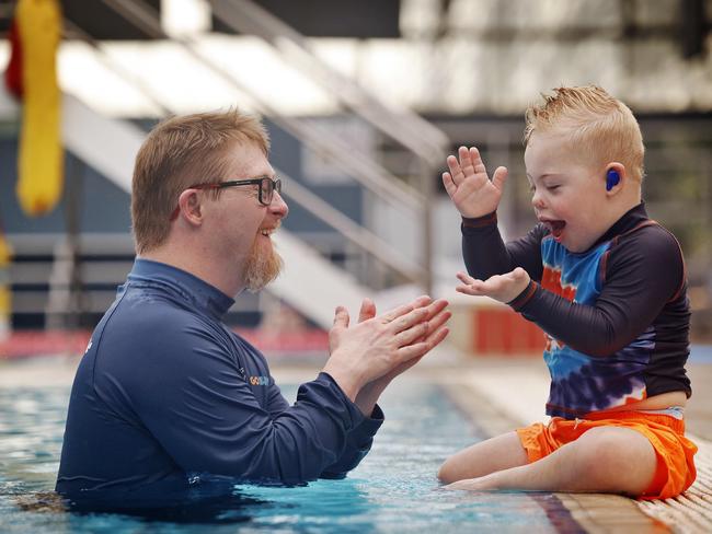 Chip and Jagger bonding over splashes at Wollondilly Leisure Centre. Picture: Sam Ruttyn