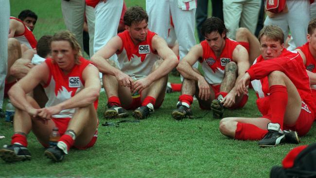 Dejected Sydney players after losing the 1996 Grand Final. Stuart Maxfield, Adam Heuskes, Simon Garlick?, Craig O'Brien, Shannon Grant.