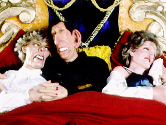 A scene from satirical 80s TV show Spitting Image featuring latex puppets of Prince Charles embracing then mistress Camilla Parker Bowles in bed with Princess Diana. Picture: Supplied