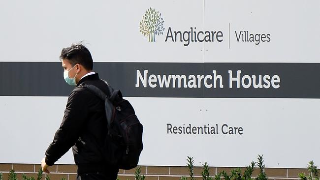 A worker leaves the Anglicare Newmarch House today, after the COVID-19 death of the sixth resident from the facility yesterday. Picture: Joel Carrett/AAP