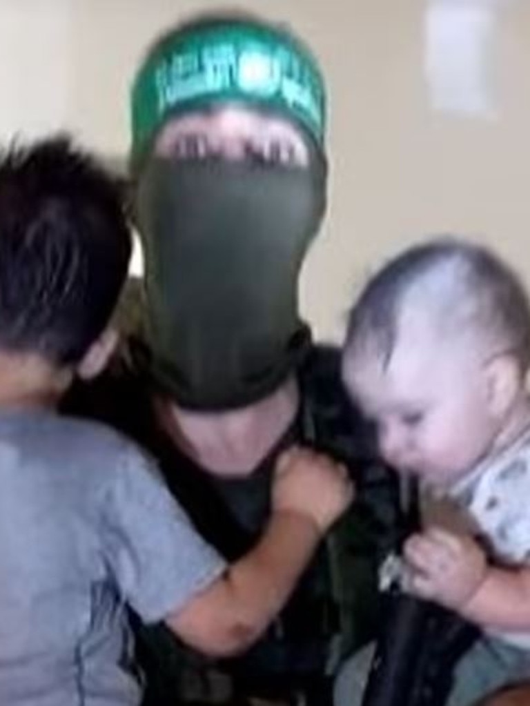 Hamas has released footage today of its members allegedly holding Israeli children and toddlers. Picture: The Jerusalem Post