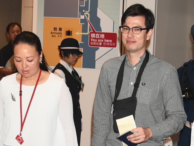 Alek Sigley is all smiles as he arrives at Haneda International airport in Tokyo. Picture: Jun Sato