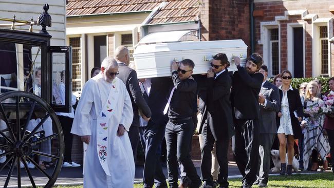 Brooke Sorlie’s casket is taken away by horse and carriage as family and friends watch on. Picture: Sam Ruttyn