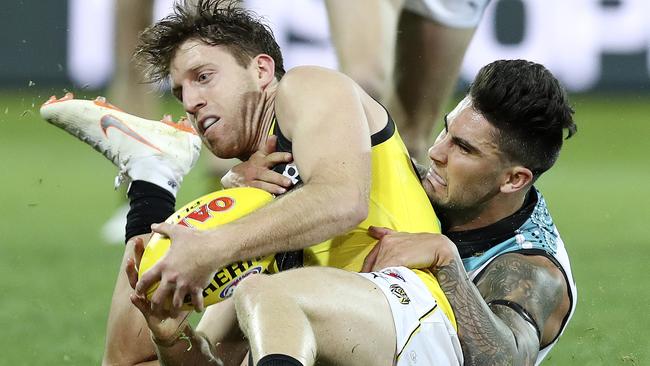 Chad Wingard wraps up Reece Conca on Friday night. Picture Sarah Reed