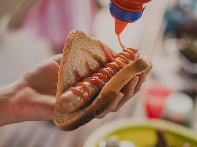 Close up shot of a sausage in a piece of bread, know as 'sausage sizzle' by the Australian community.  Picture: istock