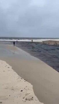 Fast-flowing stream leaves people stuck on Bribie Island beach