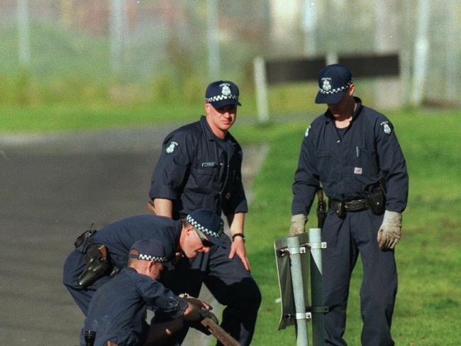 Police searched drains in the area following the shooting of Gary Silk and Rodney Miller.